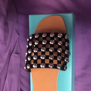 Black studded slide shoes
